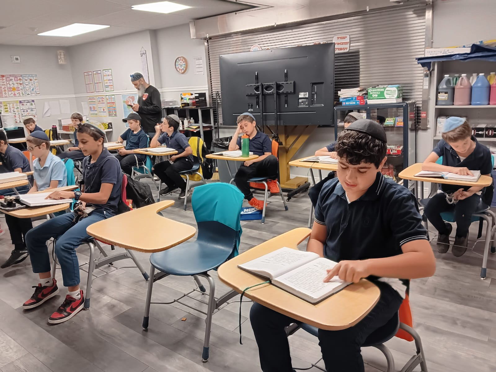 Talmidim learning at their desks
