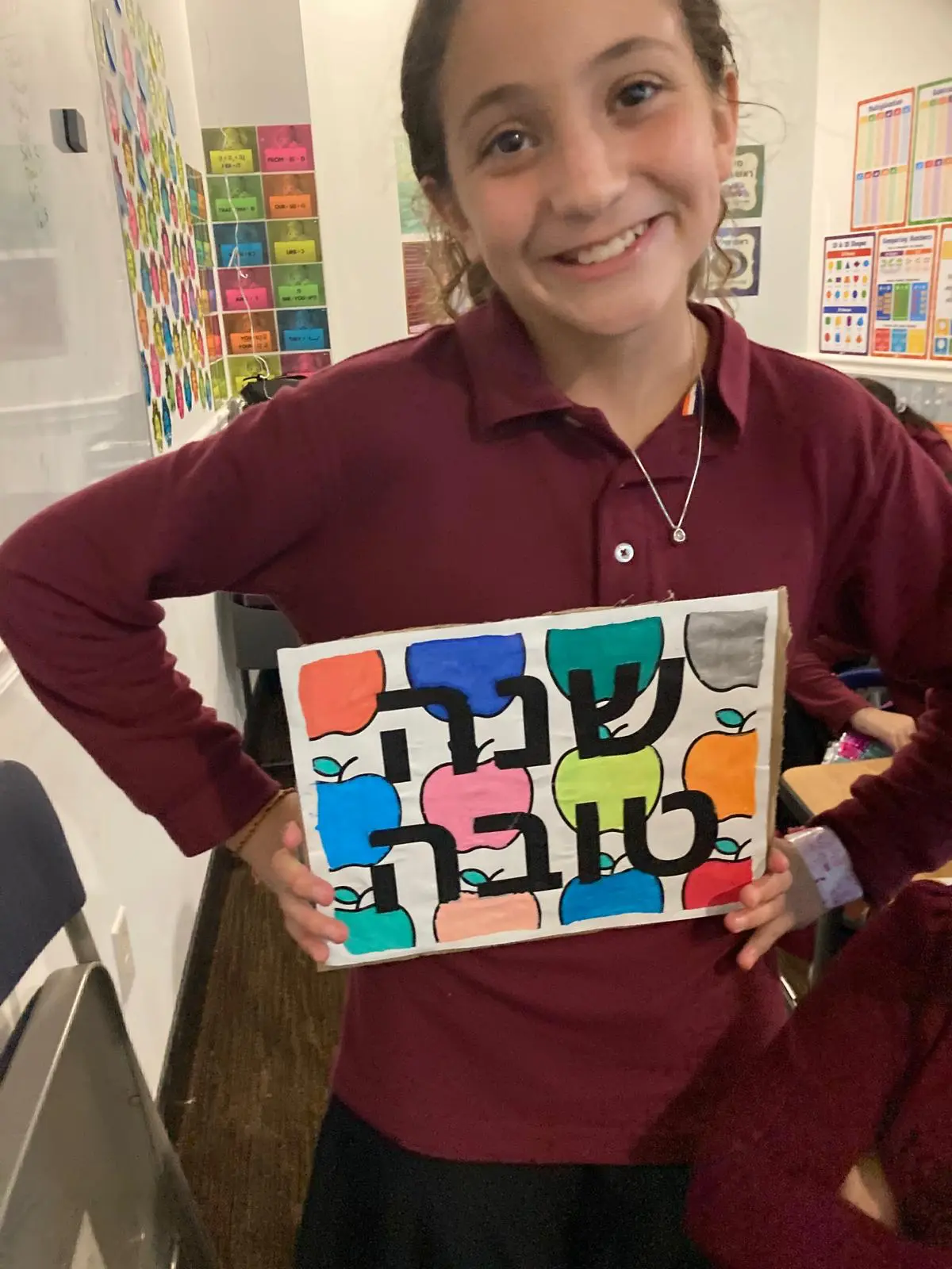 A talmida showing her Shana Tova artwork