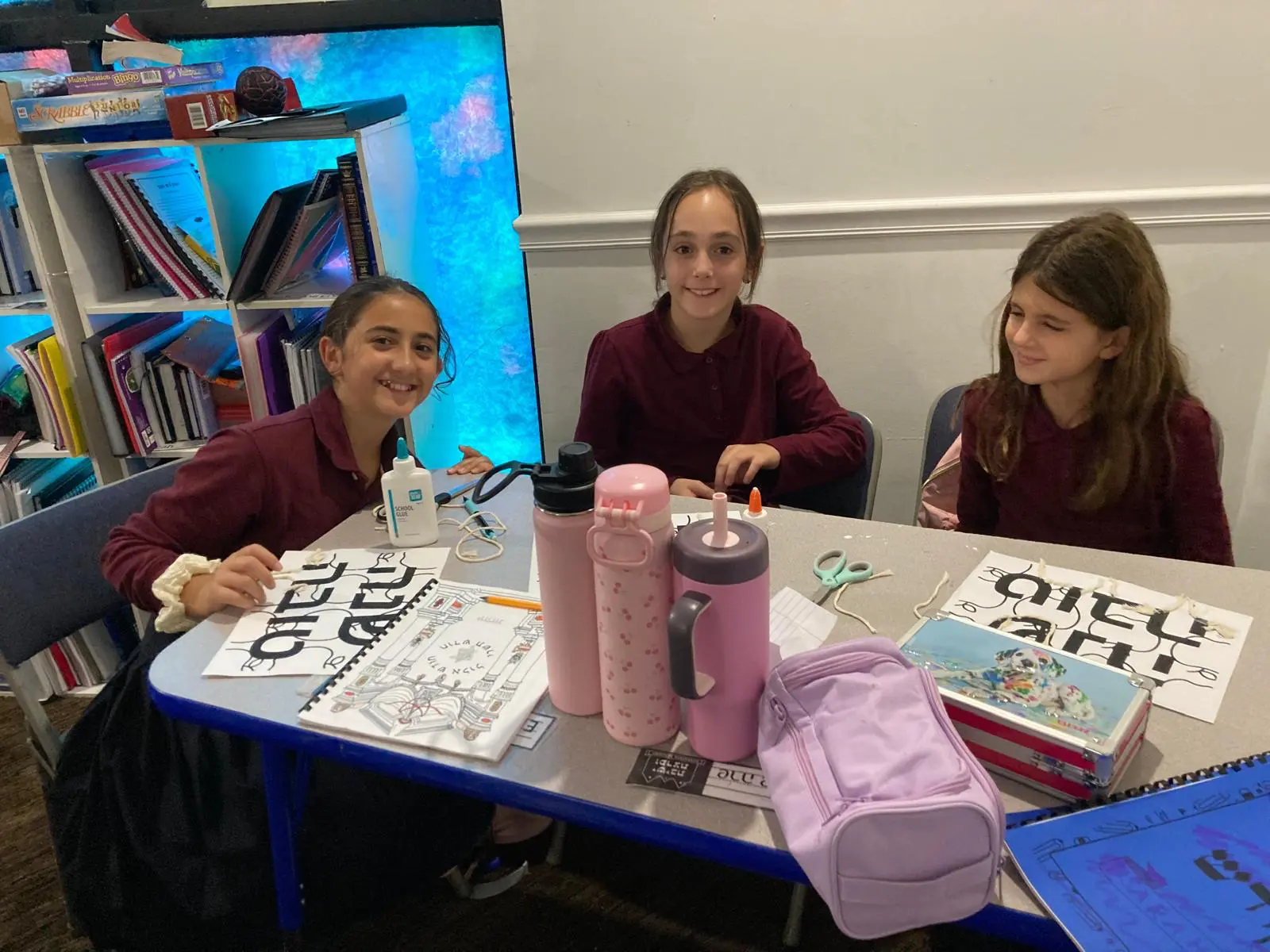 Talmidos working on a group art project